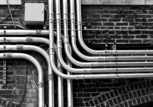 Industrial metal electrical conduits and cable penetrations sealed with weather-resistant potting and sealing compounds