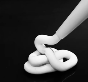 High-viscosity white heavy-duty elastomeric sealant extruded from nozzle for industrial joint sealing