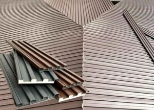 Corrugated metal roof sheet lap joints sealed with non-sag elastomeric sealant to prevent capillary leaks