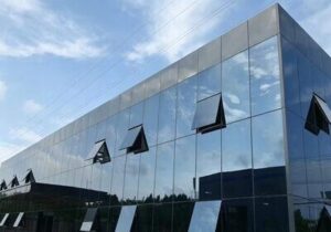 Structural glazing and weather-sealing sealant application on modern high-rise glass curtain wall seams