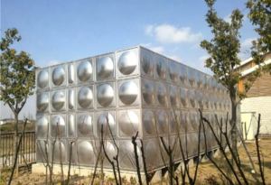 Large modular stainless steel water storage tank featuring high-performance sealant application on panel seams and base joints