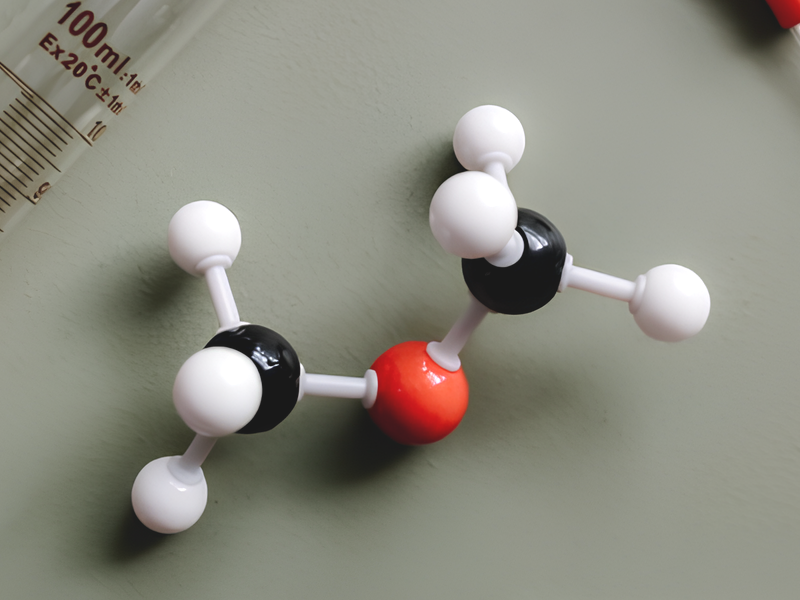 Molecular structure model and laboratory glassware representing advanced polymer resin research for high-performance industrial adhesives.